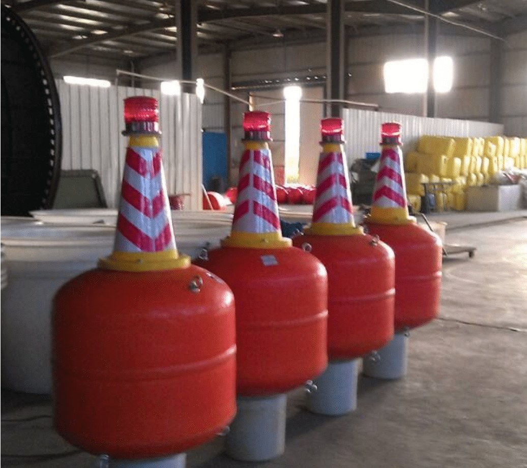 Row of small red safety hazard buoys