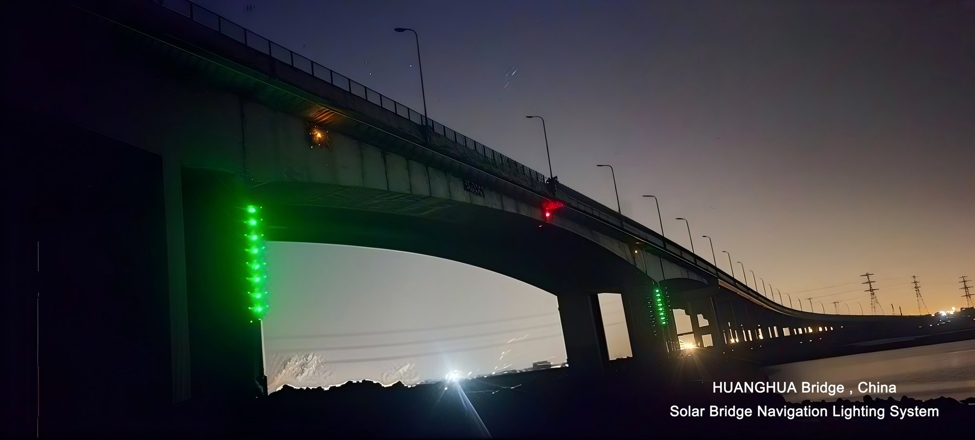 DWS303 solar bridge navigation lights marking the channel under Huanghua Bridge, China, at dusk